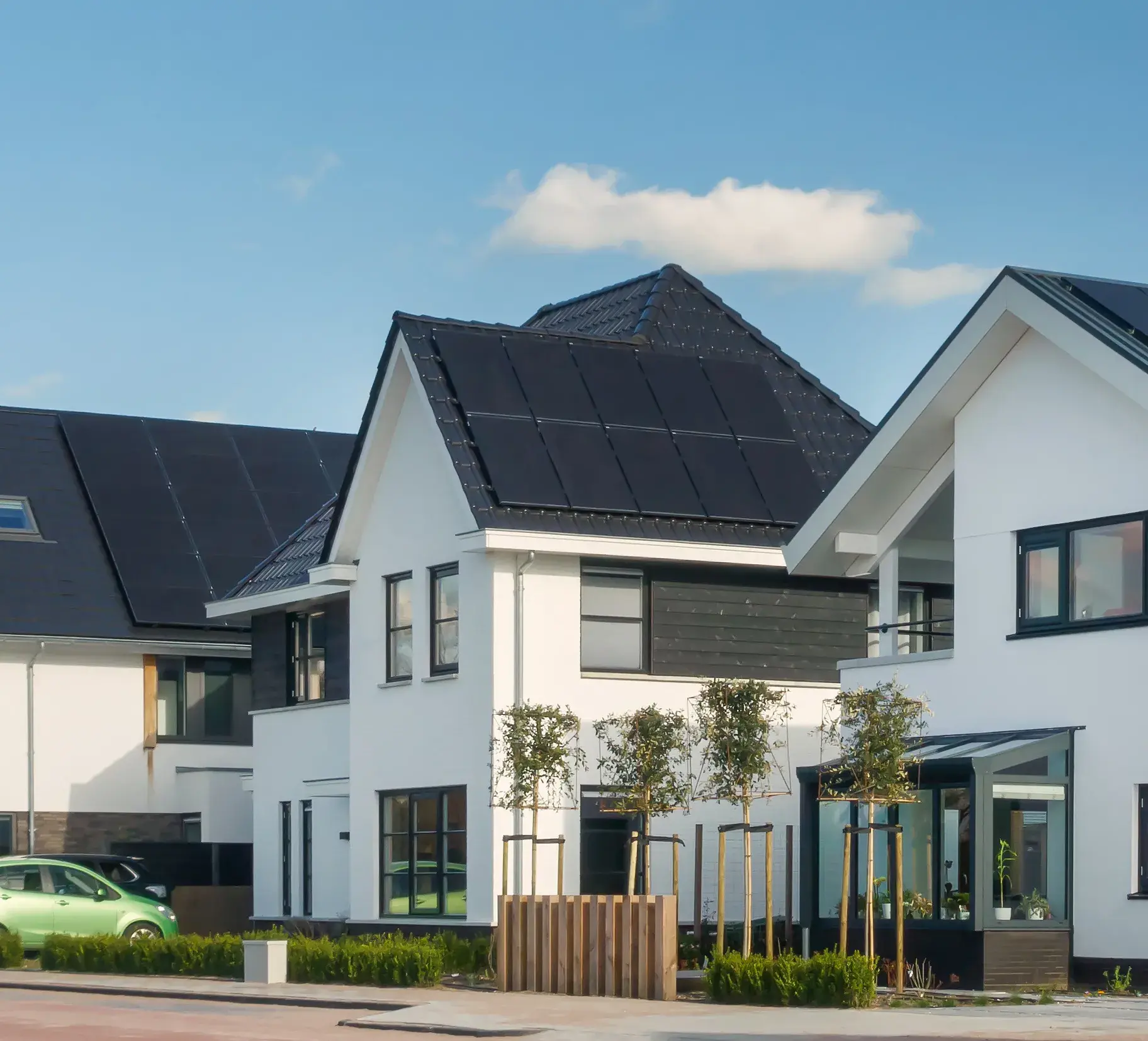 Air source heat pump installed outside a brick house